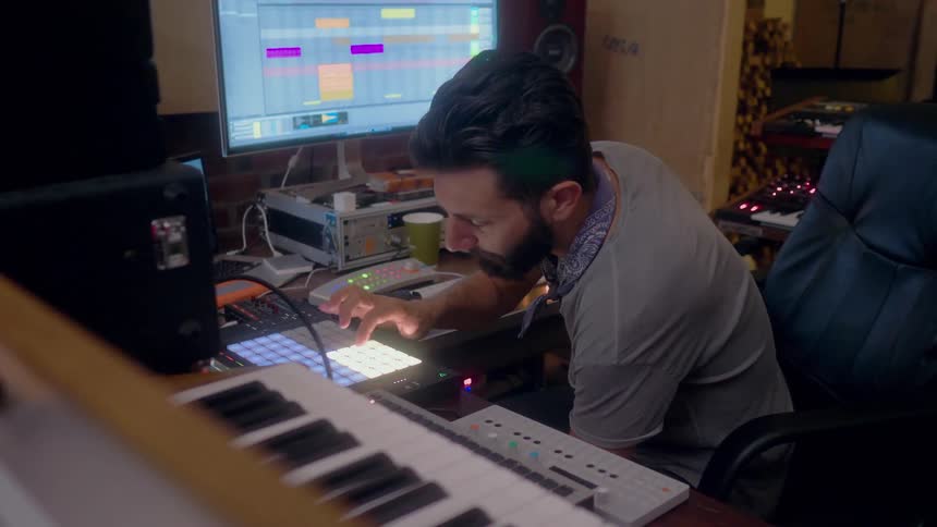 Man mixes music in a recording studio