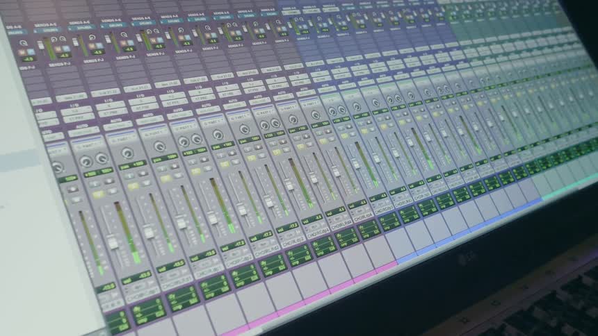 Level meters display volume levels on a studio monitor