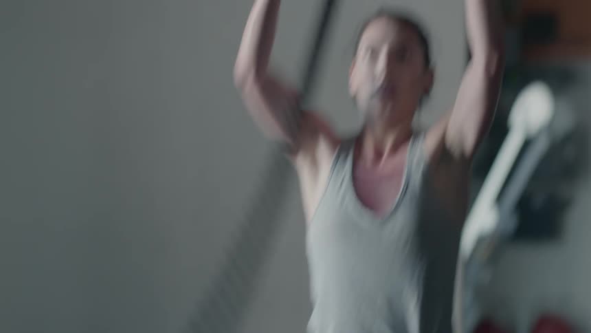 A woman exercising with ropes