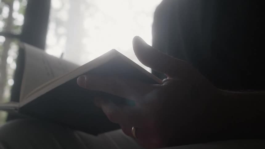 A person flips through a book