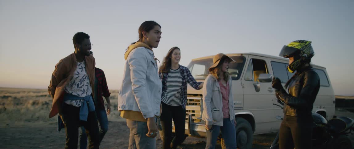 Friends meet up off road at sunset