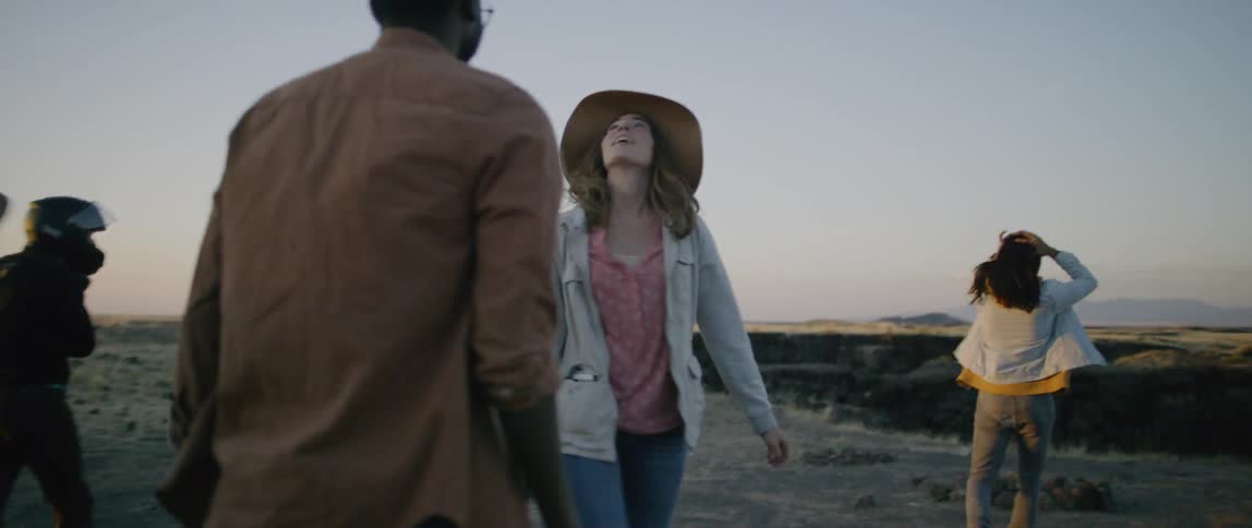 A group of people walk out in nature