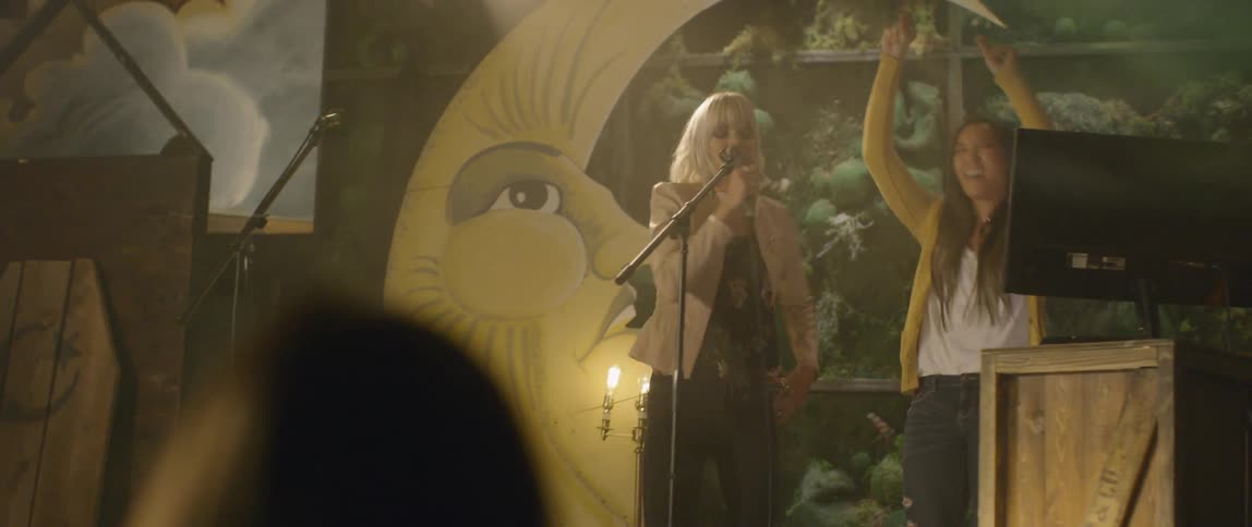 Women singing at a club