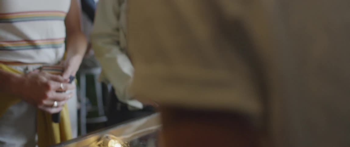 A customer hands a cashier money