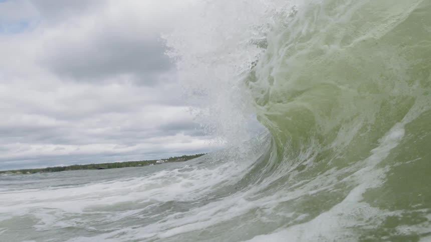 An ocean wave crashes down