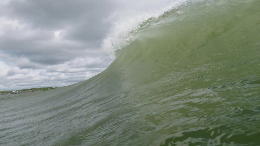 The large wave makes its way to the shore