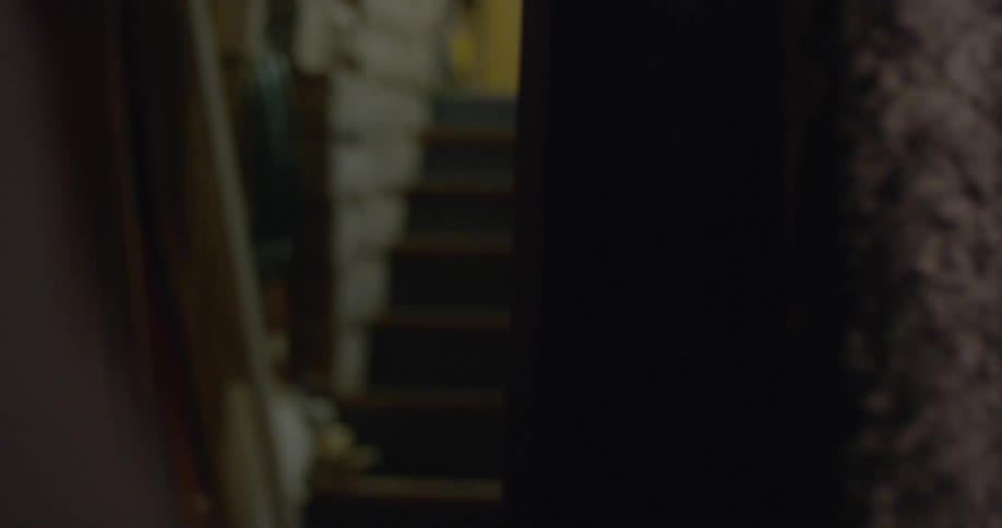 A person walks through a velvet curtain