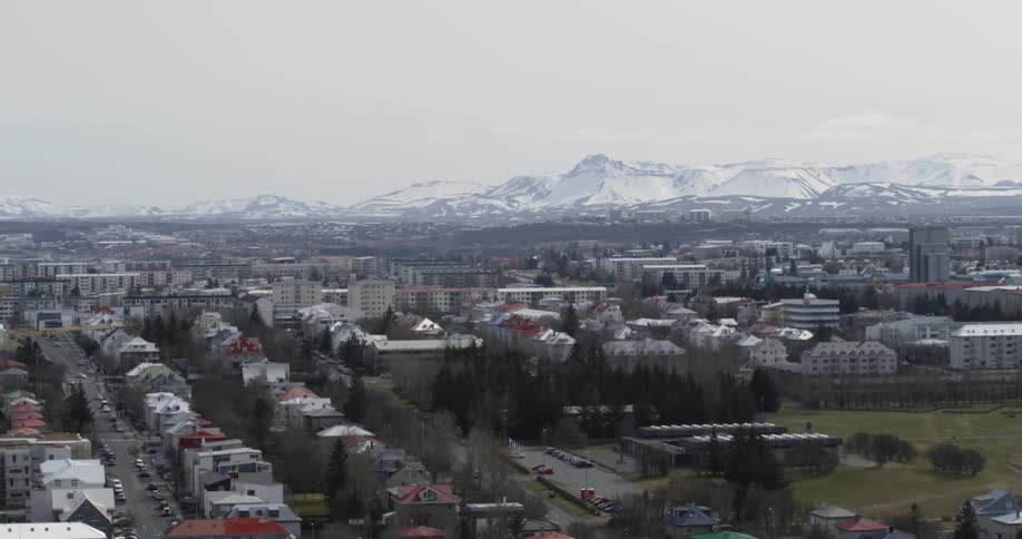A city at the base of a snowy mountain