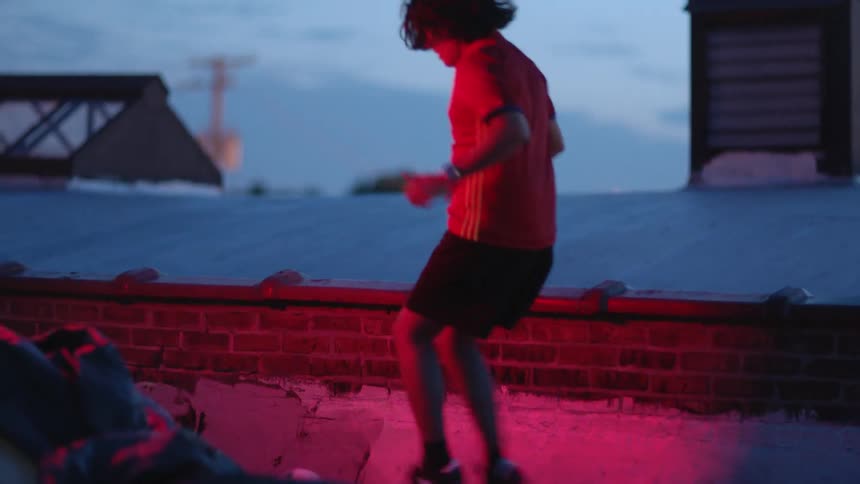 A young man dribbles a soccer ball