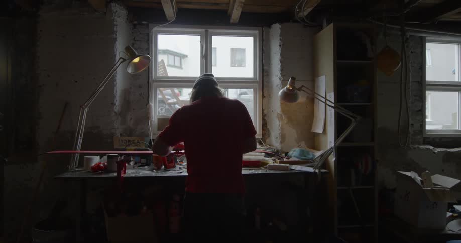 Someone is working in a machine shop silhouette