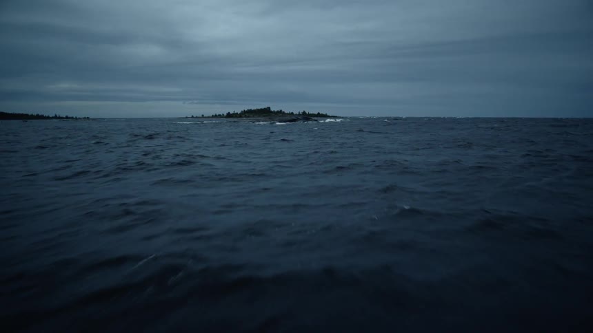 Clouds float over an ocean