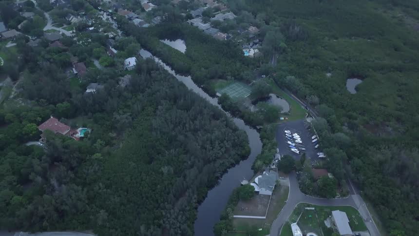 A neighborhood is surrounded by water