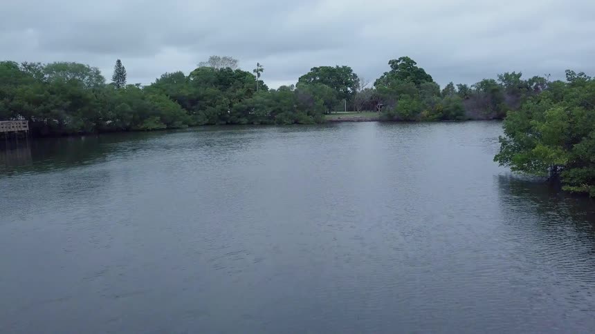 Clouds hang above a flowing river