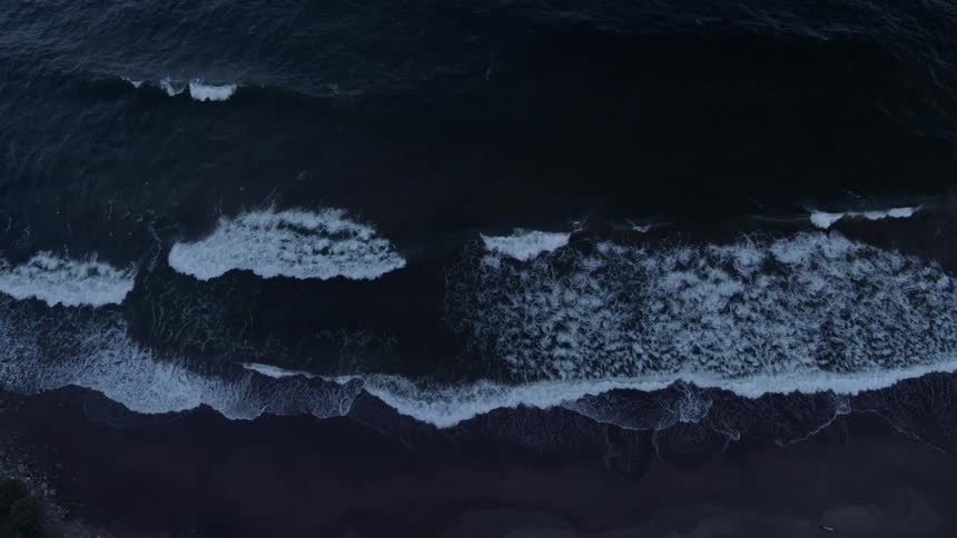Waves roll onto shore