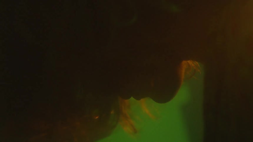 A person in a dimly lit room