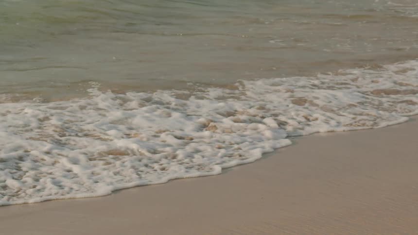 Waves are crashing on the beach