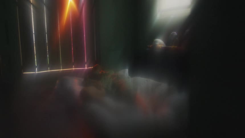 Someone is sleeping in a small bed in a room