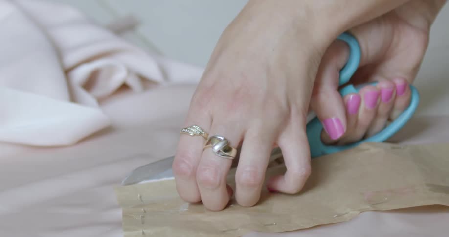 A person cutting fabric