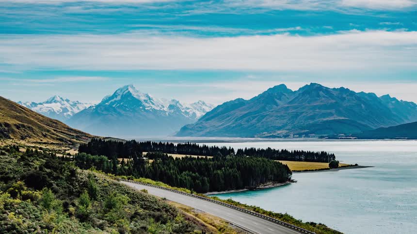 A curving road past a lake