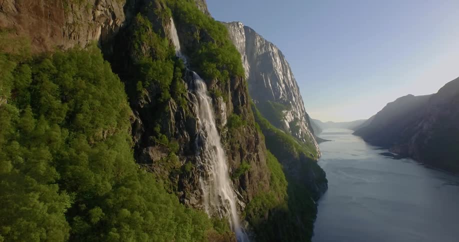 Water flows off the side of a tall cliff