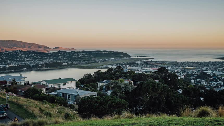 Time lapse of a seaside town as the sun goes down