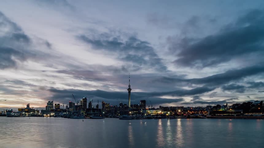 A waterside city at sunrise