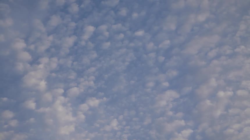 Clouds are hovering in the sky during the day