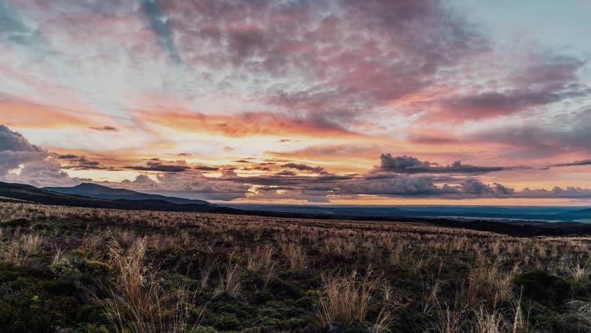 Time lapse of the sun setting over the plains