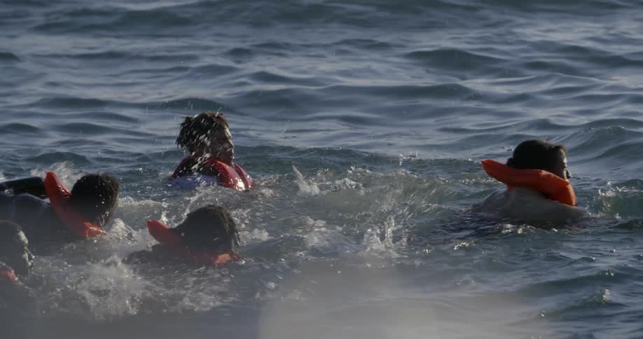 People are swimming in the water ahead