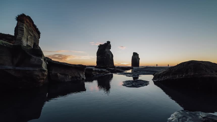 A rocky lake at sunset