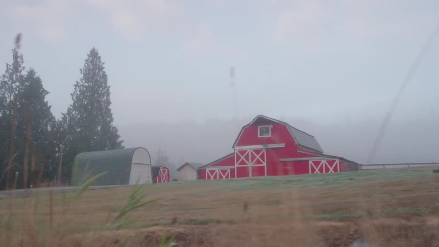 A red barn near a field