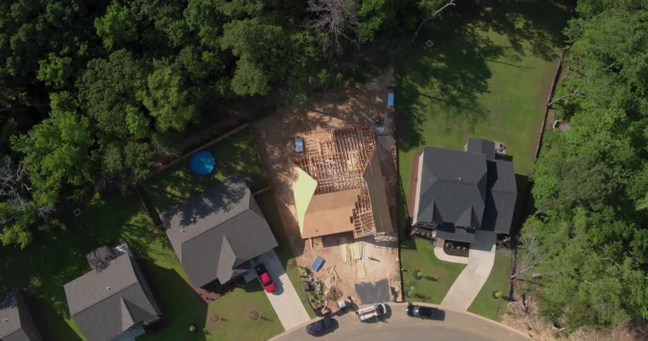 A house is being built in a neighborhood