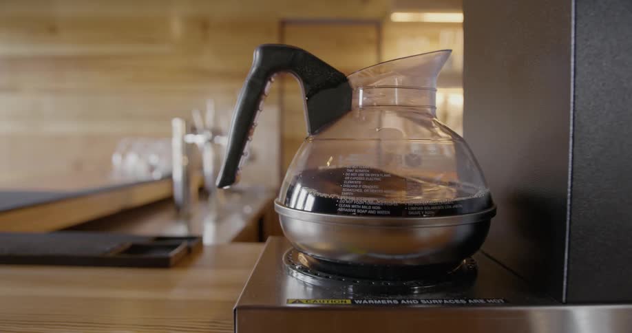 A coffee pot is placed on a burner