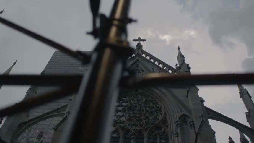 An old gothic church is filmed from the street