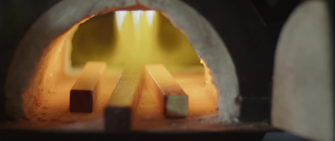 Fire heating some metal bars in an open oven