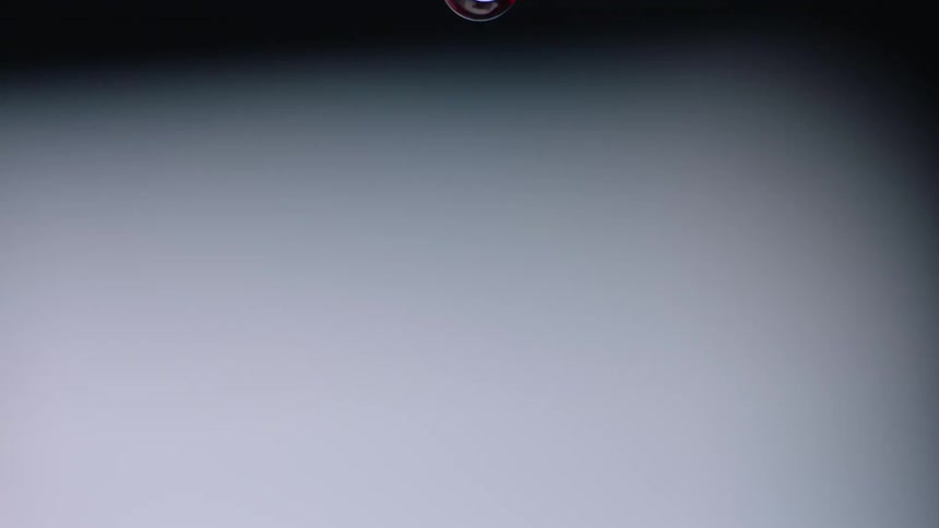 A drop of red liquid drips