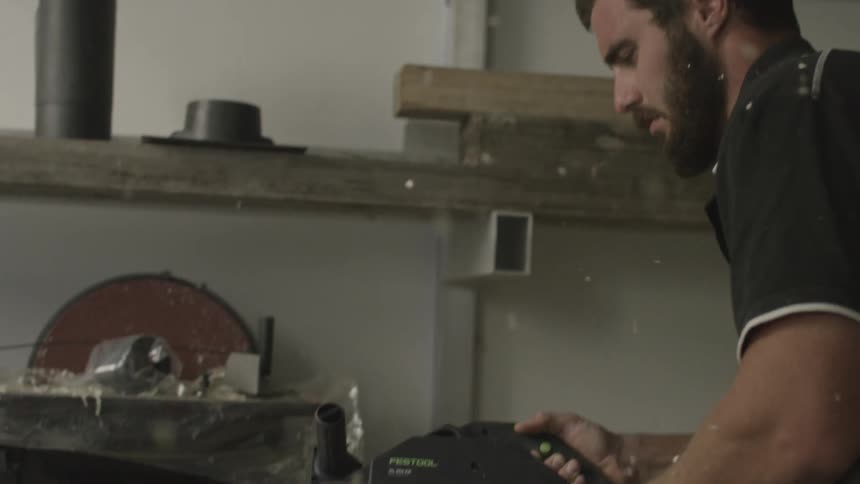 A person using a saw