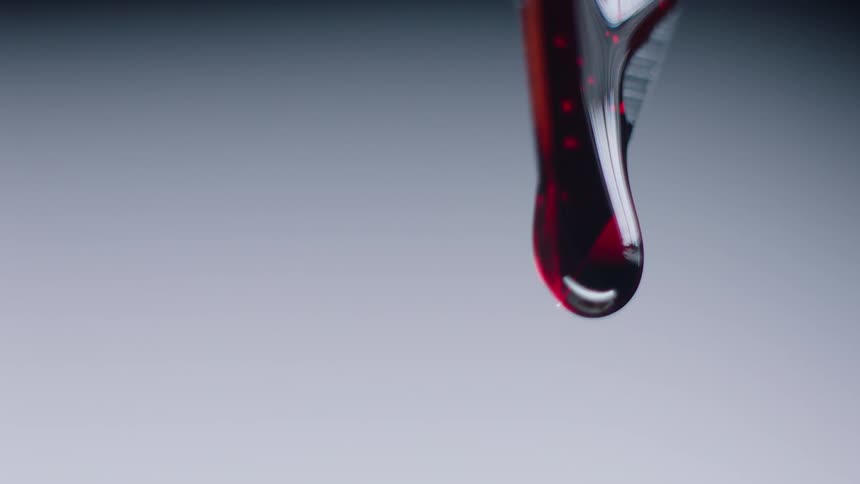 Red liquid slowly drips