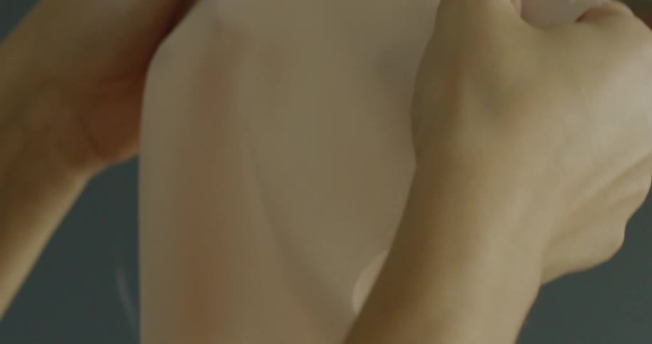 A person rubbing fabric