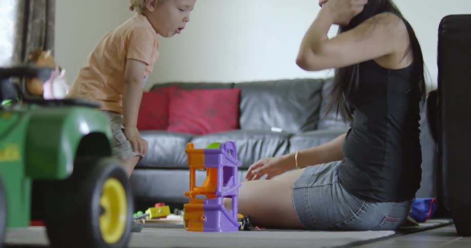 An adult playing with a child