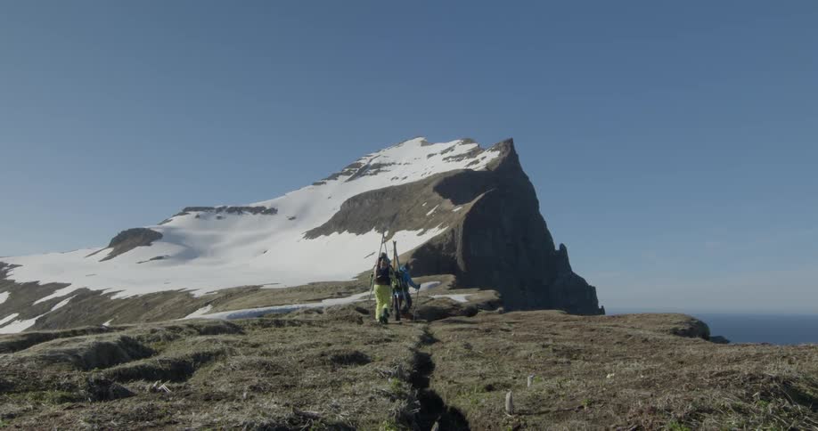 Skiers hiker in snowy mountains