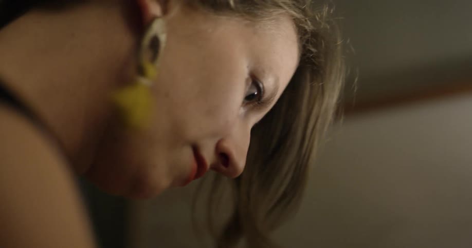 A blond woman hitting something