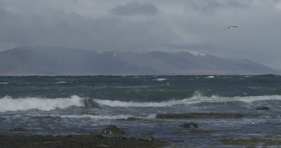 Rough seas and waves crashing on the beach