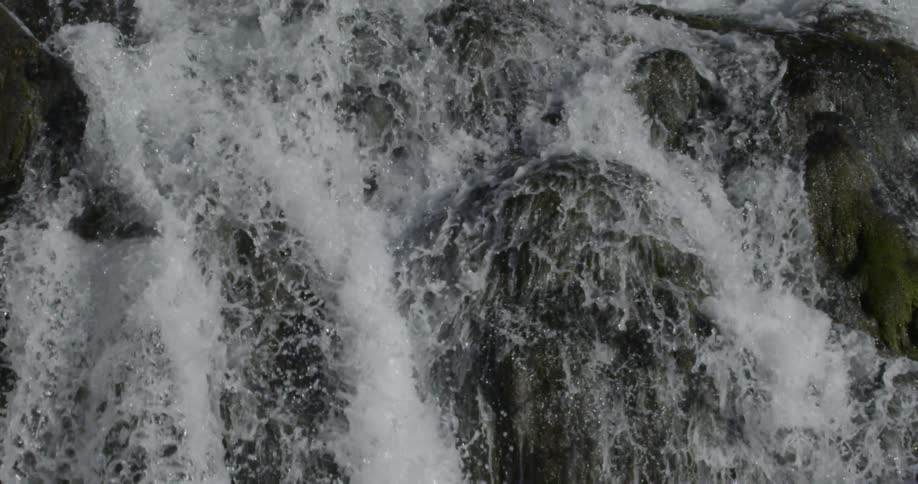River water gushes over rocks
