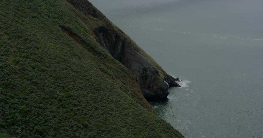 The green mountain is lined with water