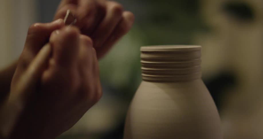 Someone is sculpting clay