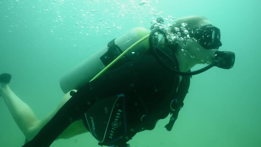 A diver swims in the ocean