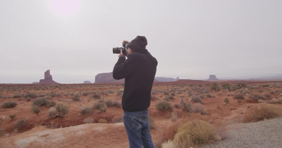 A person taking pictures of nature