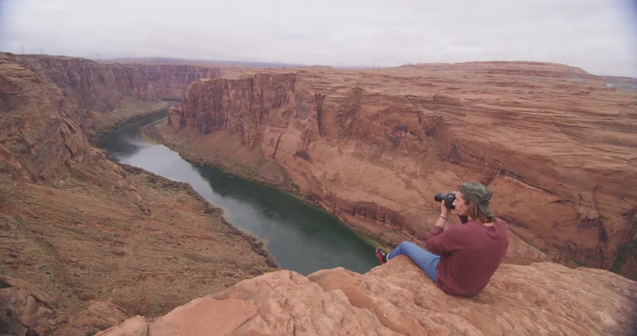 A person taking pictures of nature