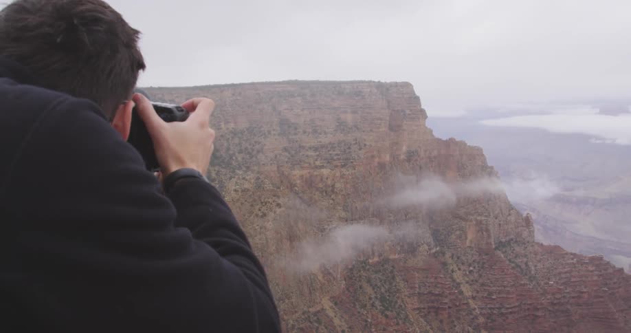A person taking pictures of nature